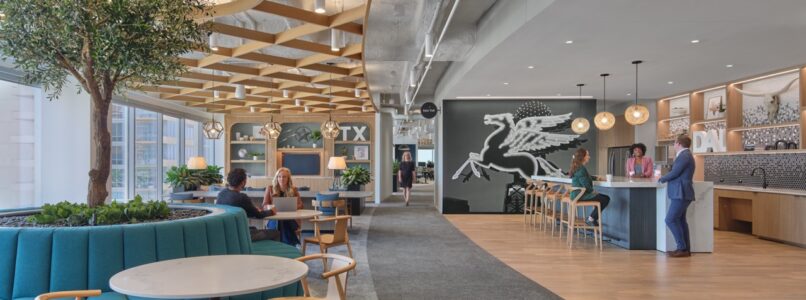 Cafe with an indoor tree, teal booth seating and a Pegasus mural in the EY Dallas office