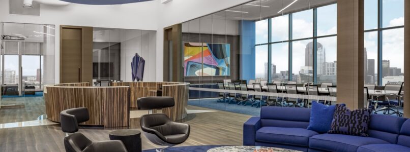 Lounge with curved blue sofas under a sculpted blue ceiling with linear lights