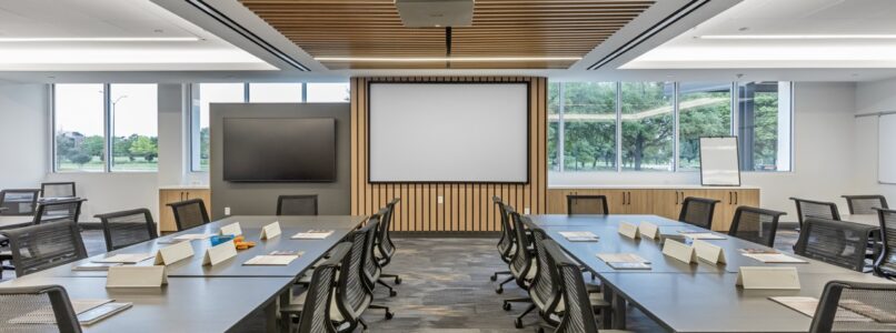 Training room with rows of tables under a wood-slat ceiling at BNSF Railway