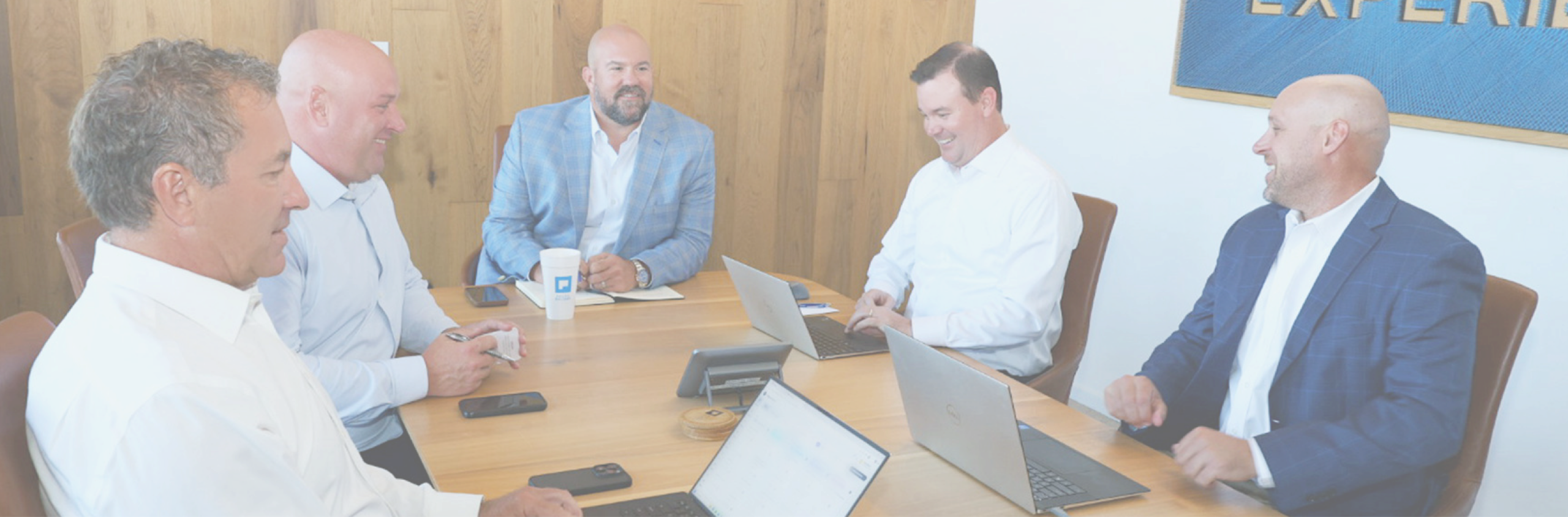 Pacific Builders leadership team meeting around a conference table