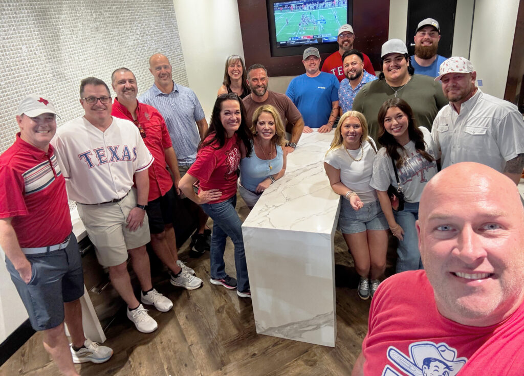 Pacific Builders team group selfie at a social gathering