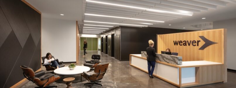 Weaver reception desk and lounge seating with linear ceiling lights